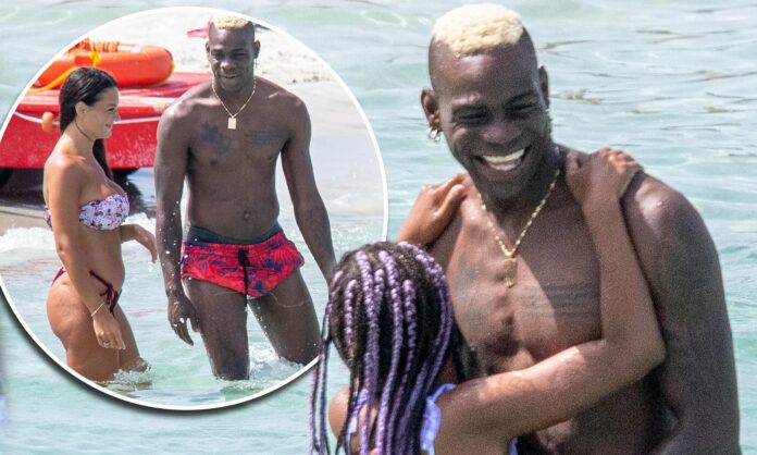 Mario Balotelli splashes in the surf with playful daughter Pia, 9, and a bikini-clad beauty as enigmatic Italian footballer unwinds during pre-season break in Sardinia