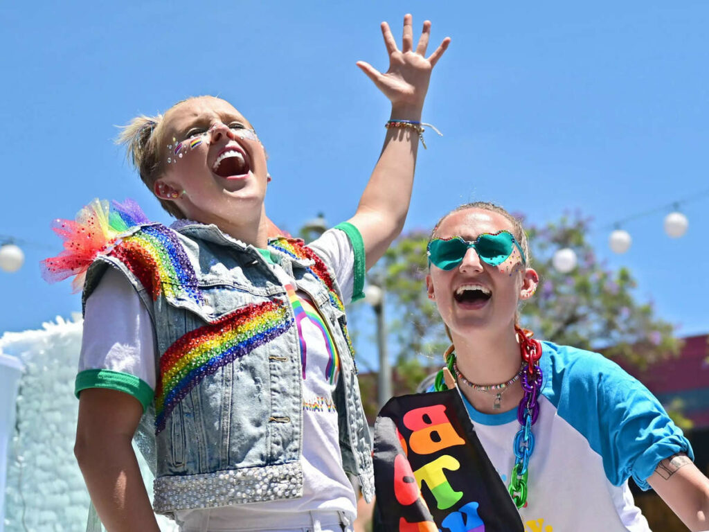 JoJo Siwa went to her first Pride parade, and her girlfriend adorably surprised her by showing up after saying she couldn't make it